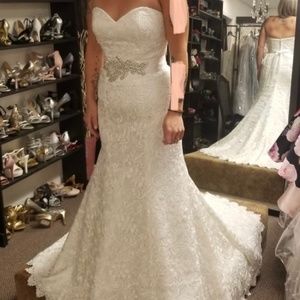 Never worn or altered wedding dress size 10